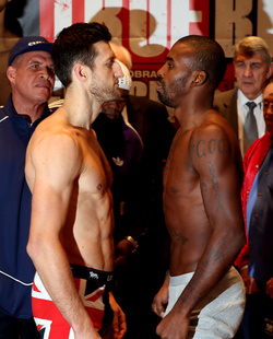 Carl Froch (L) and Yusaf Mack face off during the weigh in at Nottingham Capital FM Arena on November 16, 2012 in Nottingham, England